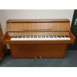 A teak cased upright overstrung piano by Bentley,