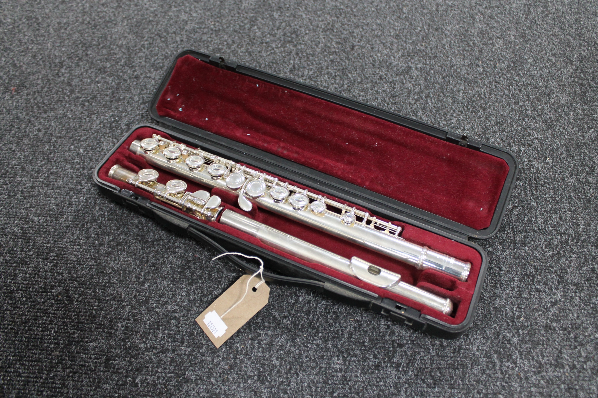 A three piece Yamaha chrome flute in fitted case