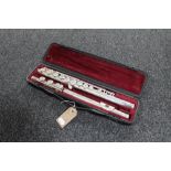A three piece Yamaha chrome flute in fitted case