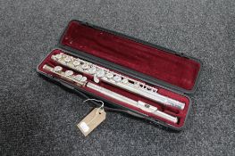 A three piece Yamaha chrome flute in fitted case