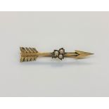 A Victorian 15ct gold seed pearl set arrow brooch, length 56mm. CONDITION REPORT: 4.