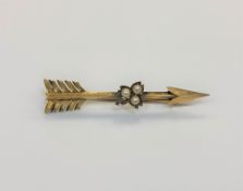 A Victorian 15ct gold seed pearl set arrow brooch, length 56mm. CONDITION REPORT: 4.