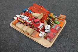 A tray of mid century and later die cast car transporters, emergency vehicles, Dinky,