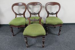 A set of four Victorian mahogany balloon backed chairs (one back cut-down)