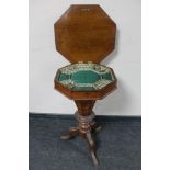 A Victorian inlaid walnut octagonal pedestal work table