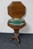 A Victorian inlaid walnut octagonal pedestal work table