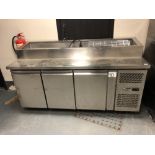 A stainless steel counter serving unit,