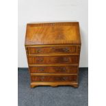 An inlaid mahogany Georgian style bureau