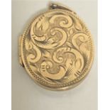 A 9ct gold oval locket, 5.3g.