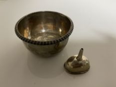 Two Georgian silver wine strainers