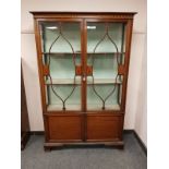 A late Victorian inlaid mahogany display cabinet,