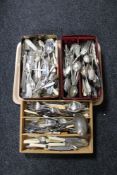 Two tins and a cutlery drawer of plated and stainless steel cutlery