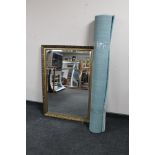 A gilt framed bevelled mirror together with a contemporary rug
