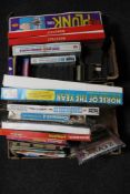 Two boxes of assorted board games, card games, children's books,