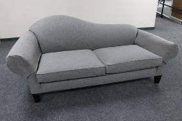 A contemporary settee in grey fabric