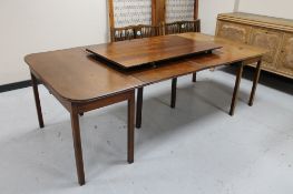 A late 19th century mahogany D-end dining table with leaf