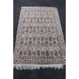 A fringed Kashmir rug,