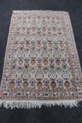 A fringed Kashmir rug,