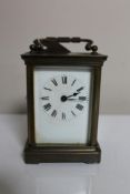 An antique brass cased eight day carriage clock with key