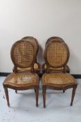 Four reproduction bergere seated dining chairs (a/f)