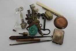 A box of collectables including silver vesta, clock keys, knife rest,