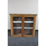 An antique pine double door glazed kitchen cabinet CONDITION REPORT: width 98cm