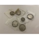 A collection of coins - 1898 shilling, 1887 sixpence, 1 guilders 1848, 1866 and 1849, 2 kroner 1904.