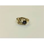 An 18ct gold sapphire and diamond set ring, size N/O, 3.7g.