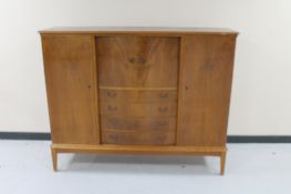 A mid 20th century continental walnut four door sideboard