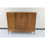 A mid 20th century continental walnut four door sideboard