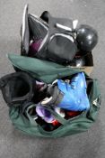 A box and a holdall of ski boots and helmets