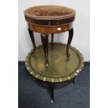 An antique dressing table stool and a brass topped table