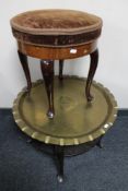 An antique dressing table stool and a brass topped table