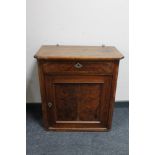 A 19th century mahogany cupboard fitted a drawer above