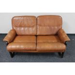 A mid 20th century Danish tan leather two seater settee