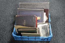 A box of antique and later postcards, antique sketch albums,