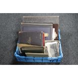 A box of antique and later postcards, antique sketch albums,