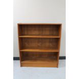 A set of mid 20th century teak open shelves