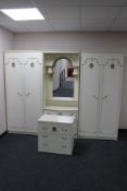 A three piece cream and gilt bedroom unit plus matching three drawer chest