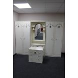 A three piece cream and gilt bedroom unit plus matching three drawer chest