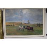 A 20th century gilt framed oil depicting cows by N.