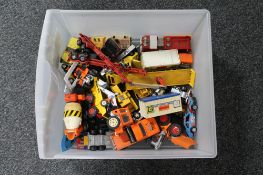 A box of mid century and later die cast vehicles, car transporter,