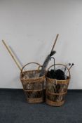 Two 20th century wicker log baskets containing parasol, cricket set, sticks, peacock feathers,