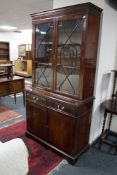 An inlaid mahogany Regency style bookcase