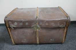 An antique bentwood bound travelling trunk