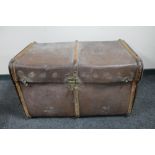 An antique bentwood bound travelling trunk