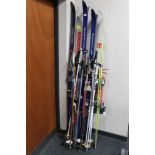 Five assorted pairs of skis including Fischer,