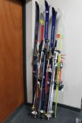 Five assorted pairs of skis including Fischer,