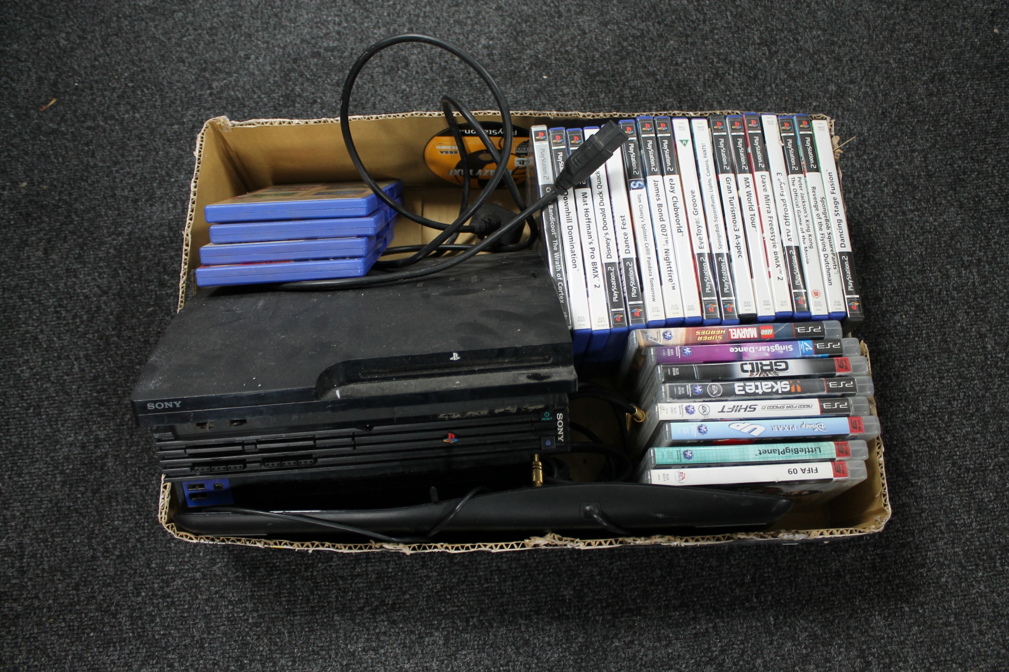 A box of Playstation 2 and Playstation 3 with leads and a quantity of games plus a computer