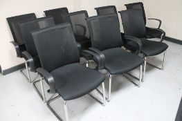 A set of nine Vector black armchairs on tubular metal legs